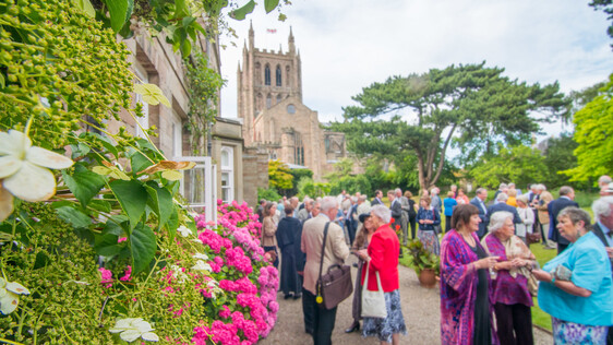 People socialising outside Bishops Palace